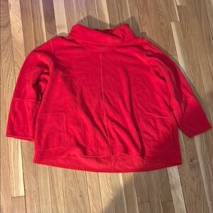 Used Women’s Red long sleeve top with turtle neck collar and pockets Size 30/32